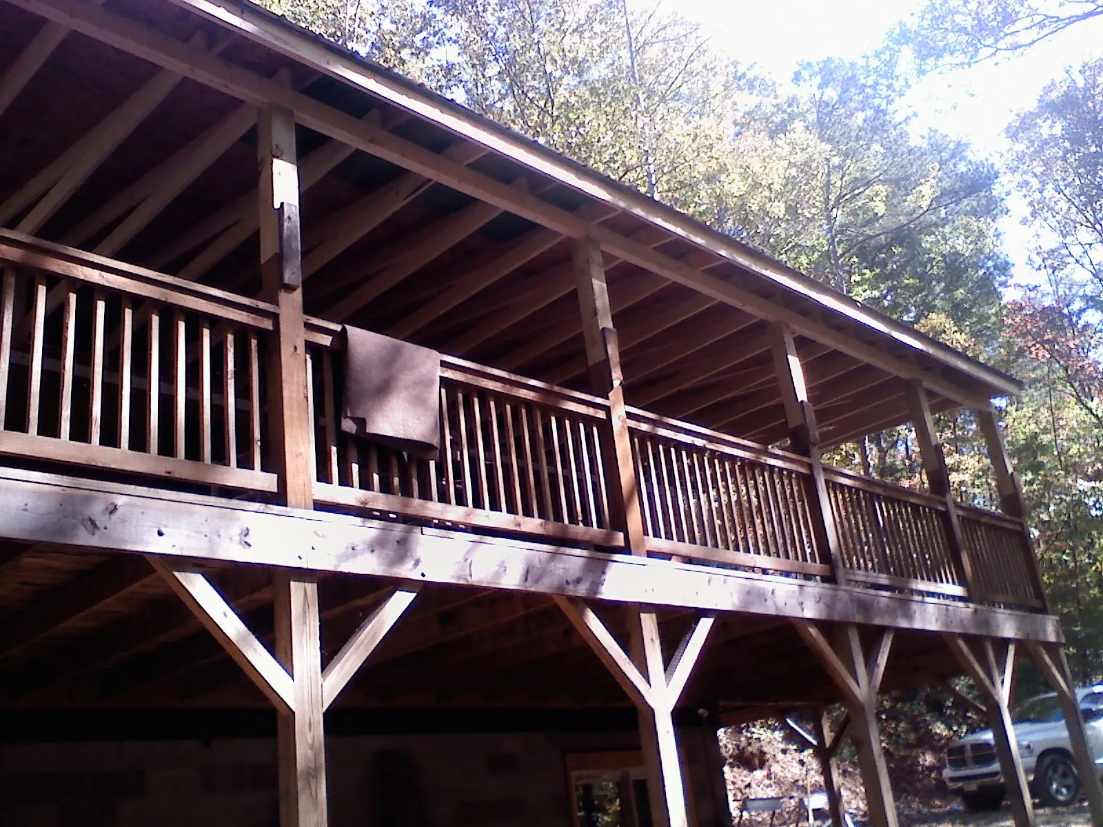 Timber framing under a new elevated porch and deck — Roof Leak Repair in Saint Ann by Roofing Brothers